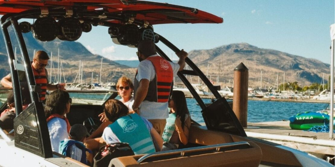 The pre-departure orientation on the dock. Lifejackets on, questions answered, Okanagan Lake straight ahead.