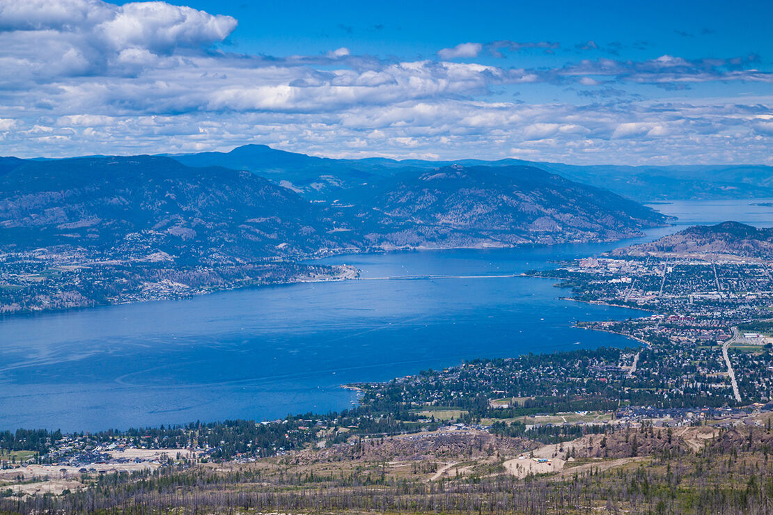 Okanagan Lake stretches from Vernon to Penticton, with Kelowna and the William R. Bennett Bridge sitting right in the middle of the view.